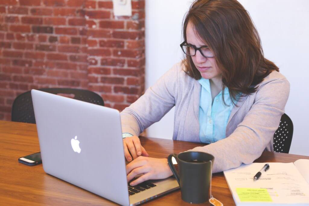 Woman typing on computer